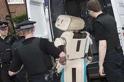 The confused.com robot being taken into custody earlier today, yesterday